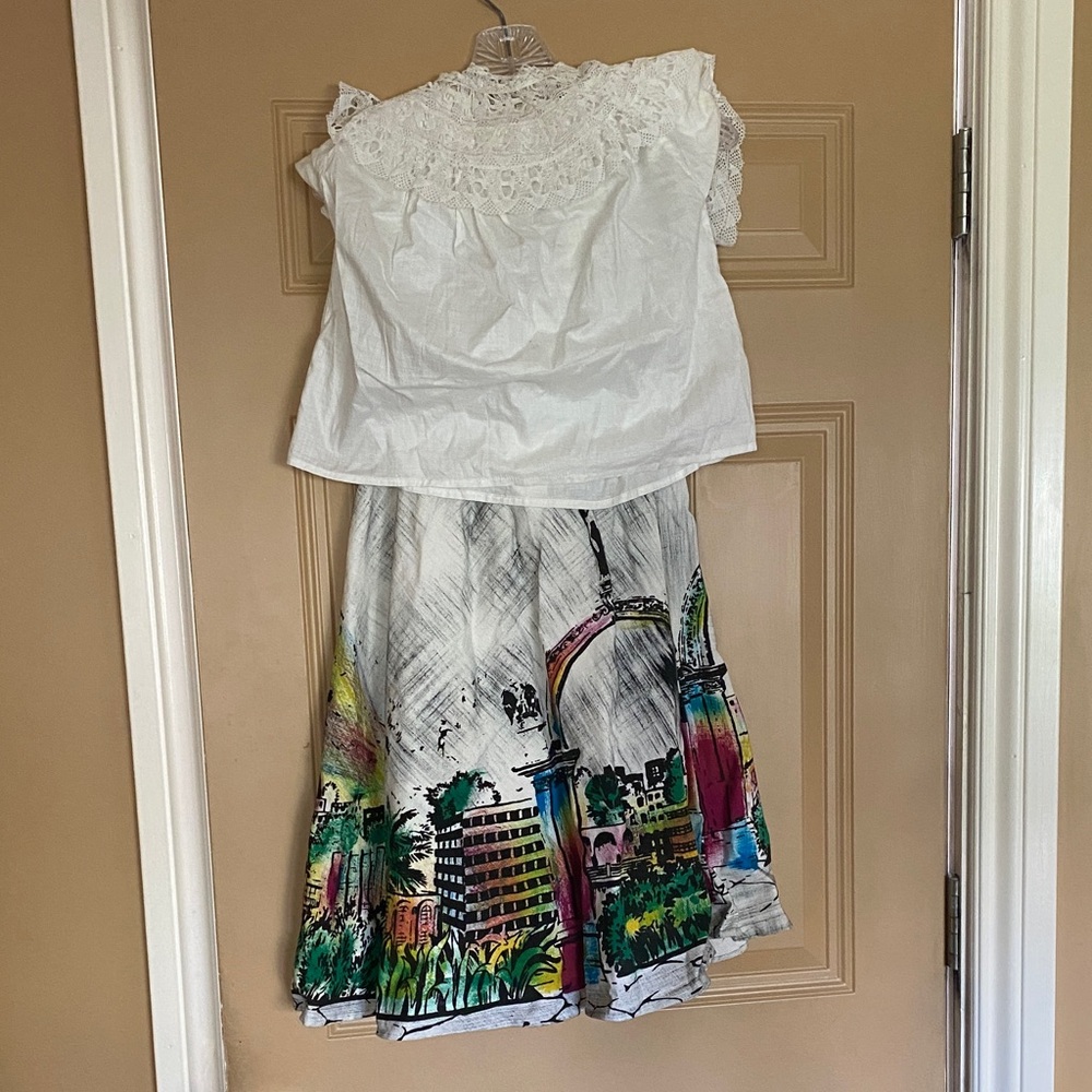 White Lace Blouse and Colorful Cityscape Skirt